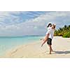 happy young romantic couple in love have fun running and relaxing on beautiful beach