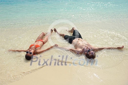 happy young romantic couple in love have fun running and relaxing on beautiful beach happy young romantic couple in love have fun running and relaxing on beautiful beach