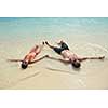happy young romantic couple in love have fun running and relaxing on beautiful beach