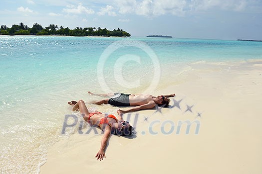 happy young romantic couple in love have fun running and relaxing on beautiful beach happy young romantic couple in love have fun running and relaxing on beautiful beach