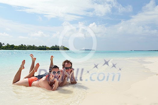 happy young romantic couple in love have fun running and relaxing on beautiful beach happy young romantic couple in love have fun running and relaxing on beautiful beach