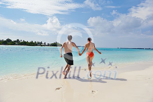 happy young romantic couple in love have fun running and relaxing on beautiful beach happy young romantic couple in love have fun running and relaxing on beautiful beach