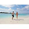 happy young romantic couple in love have fun running and relaxing on beautiful beach