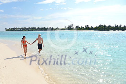 happy young romantic couple in love have fun running and relaxing on beautiful beach happy young romantic couple in love have fun running and relaxing on beautiful beach
