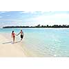 happy young romantic couple in love have fun running and relaxing on beautiful beach