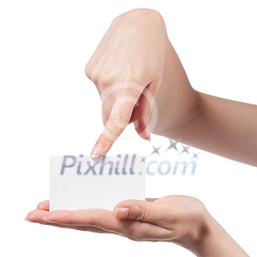 Woman hand holding empty visiting card and pointing on it isolated on white Woman hand holding empty visiting card and pointing on it isolated on white