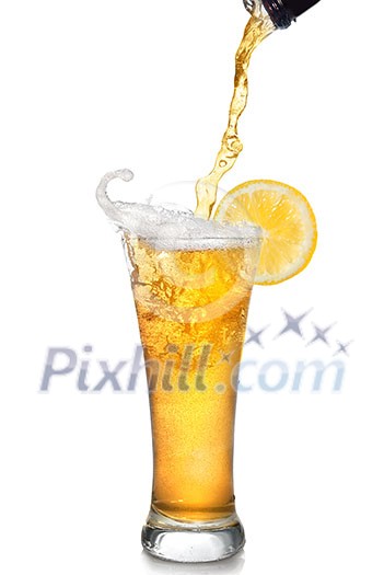 Beer pouring from bottle into glass with lemon isolated on white Beer pouring from bottle into glass with lemon isolated on white