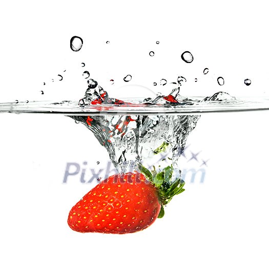 Fresh strawberry dropped into water with splash isolated on white Fresh strawberry dropped into water with splash isolated on white