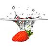 Fresh strawberry dropped into water with splash isolated on white