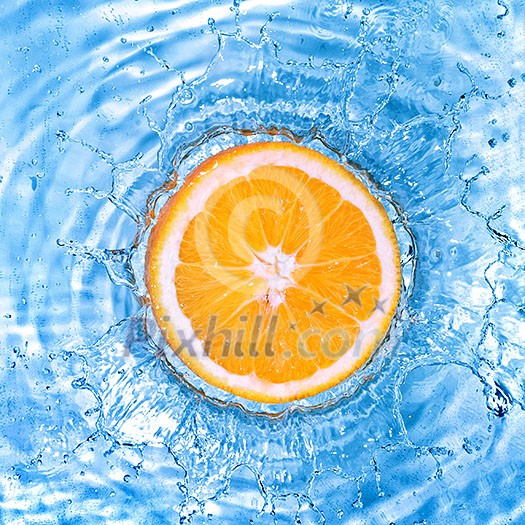 Fresh orange dropped into water with bubbles isolated on white Fresh orange dropped into water with bubbles isolated on white