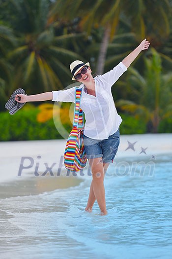 beautifel and happy woman girl on beach have fun and relax on summer vacation over the beautiful tropical sea beautifel and happy woman girl on beach have fun and relax on summer vacation over the beautiful tropical sea