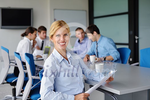 business woman with her staff, people group in background at modern bright office indoors business woman with her staff, people group in background at modern bright office indoors