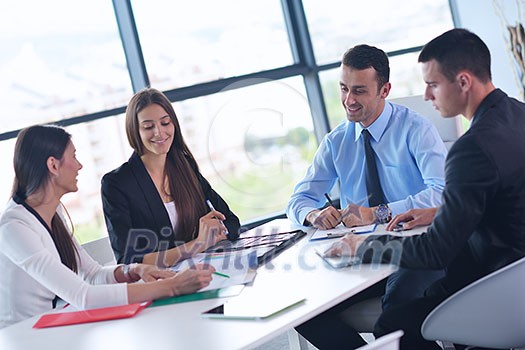 Group of happy young business people in a meeting at office Group of happy young business people in a meeting at office