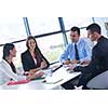 Group of happy young  business people in a meeting at office