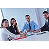 Group of happy young  business people in a meeting at office