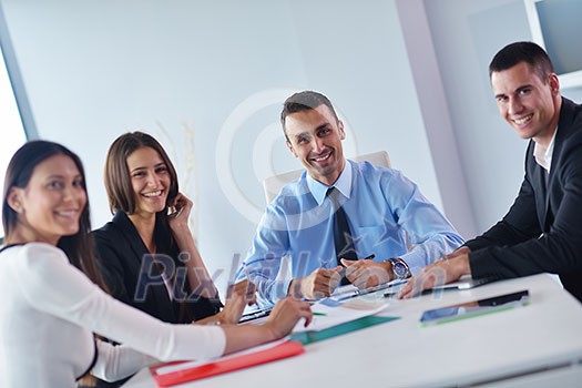 Group of happy young business people in a meeting at office Group of happy young business people in a meeting at office