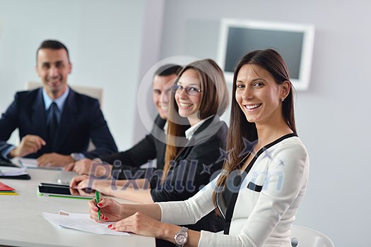Group of happy young business people in a meeting at office Group of happy young business people in a meeting at office