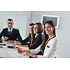 Group of happy young  business people in a meeting at office
