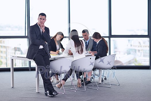 Group of happy young business people in a meeting at office Group of happy young business people in a meeting at office