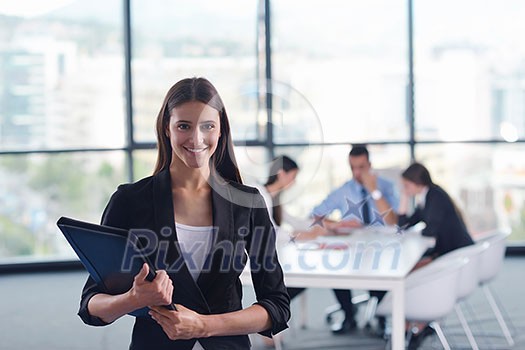 Group of happy young business people in a meeting at office Group of happy young business people in a meeting at office