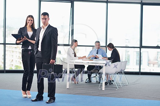 Group of happy young business people in a meeting at office Group of happy young business people in a meeting at office