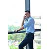 business man talking by cellphone in office