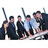 Group of happy young  business people in a meeting at office
