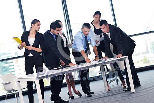Group of happy young business people in a meeting at office Group of happy young business people in a meeting at office