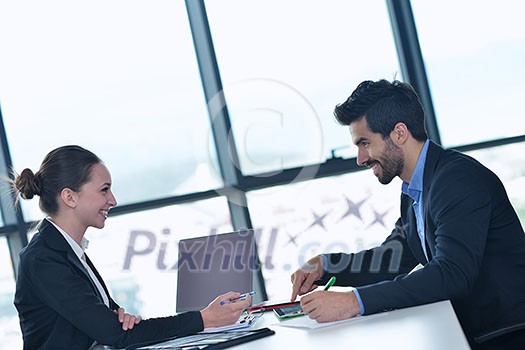 Group of happy young business people in a meeting at office Group of happy young business people in a meeting at office
