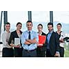 Group of happy young  business people in a meeting at office