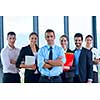 business people group joining hands and stay as team in circle  and representing concept of friendship and teamwork