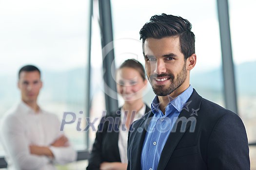 Group of happy young business people in a meeting at office Group of happy young business people in a meeting at office