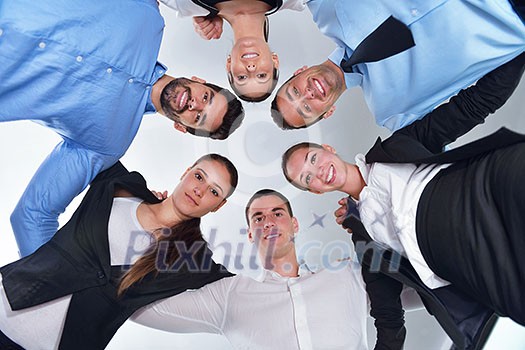 business people group joining hands and representing concept of friendship and teamwork, low angle view business people group joining hands and representing concept of friendship and teamwork, low angle view