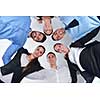 business people group joining hands and representing concept of friendship and teamwork,  low angle view