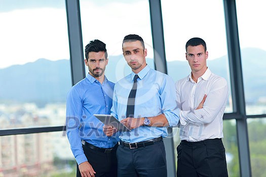 Group of happy young business people in a meeting at office Group of happy young business people in a meeting at office