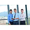 Group of happy young  business people in a meeting at office