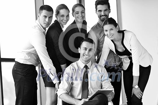 Group of happy young business people in a meeting at office Group of happy young business people in a meeting at office