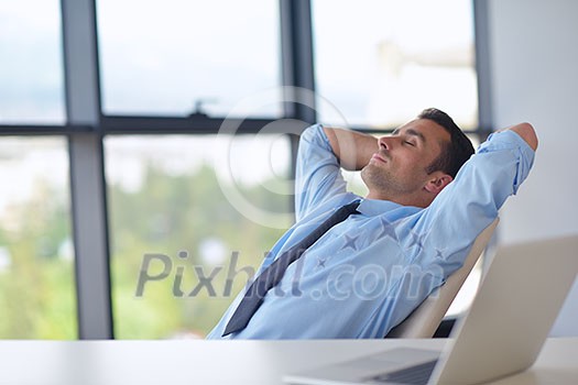 happy young business man work in modern office on computer happy young business man work in modern office on computer