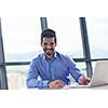 happy young business  man work in modern office on computer