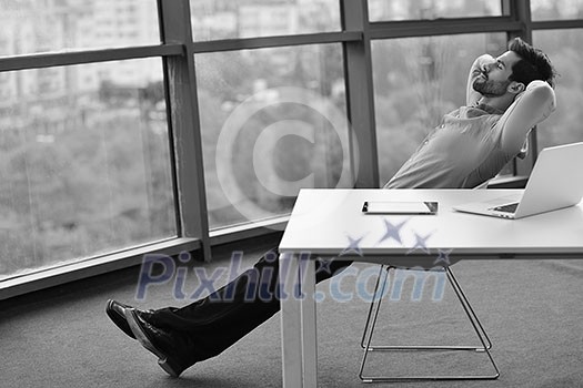 happy young business man work in modern office on computer happy young business man work in modern office on computer