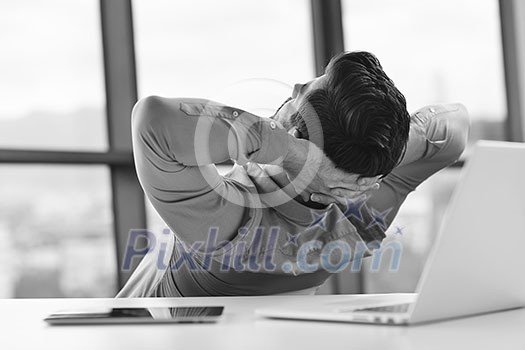 happy young business man work in modern office on computer happy young business man work in modern office on computer