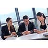 Group of happy young  business people in a meeting at office