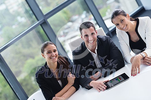 Group of happy young business people in a meeting at office Group of happy young business people in a meeting at office