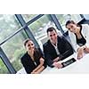 Group of happy young  business people in a meeting at office