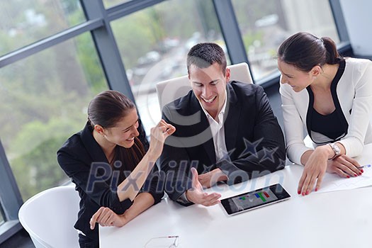 Group of happy young business people in a meeting at office Group of happy young business people in a meeting at office