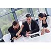 Group of happy young  business people in a meeting at office