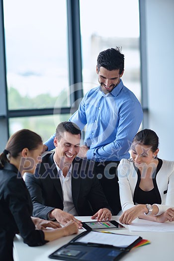Group of happy young business people in a meeting at office Group of happy young business people in a meeting at office