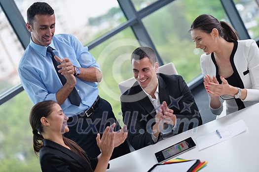 Group of happy young  business people in a meeting at office