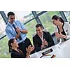 Group of happy young  business people in a meeting at office