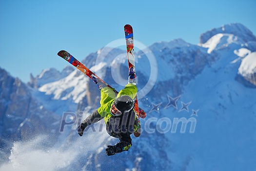 jumping skier at mountain winter snow fresh suny day jumping skier at mountain winter snow fresh suny day